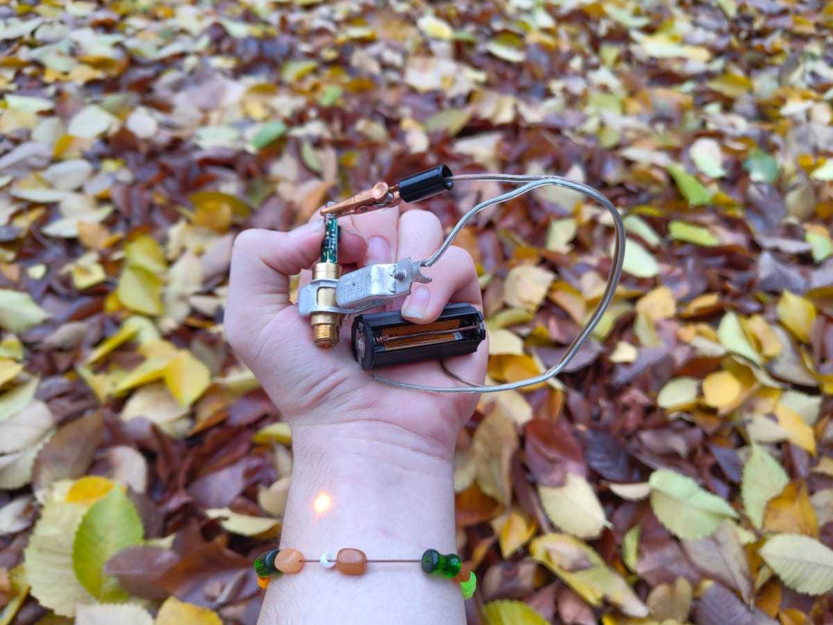 My holding and turning on a laser I put together out of scraps I found.